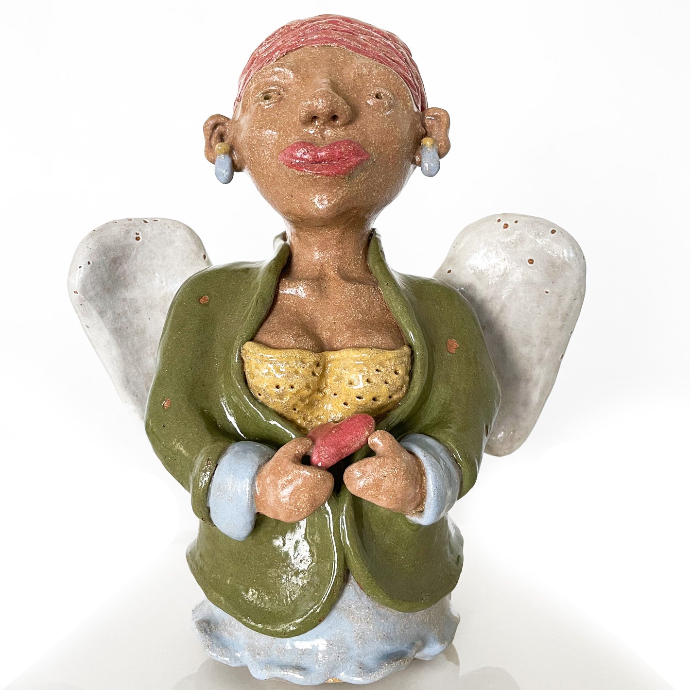 Unique angel sculpture holding a heart