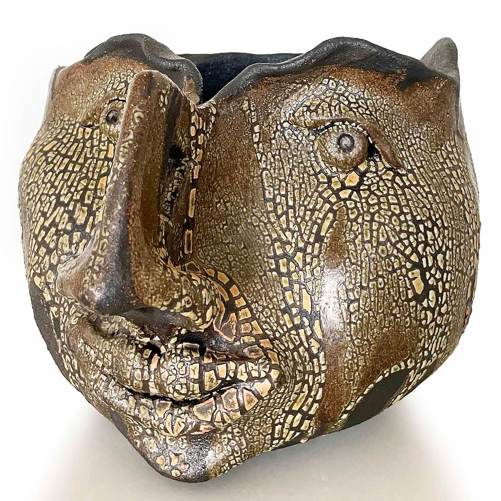 Unique beige & brown face sculpture for home decor