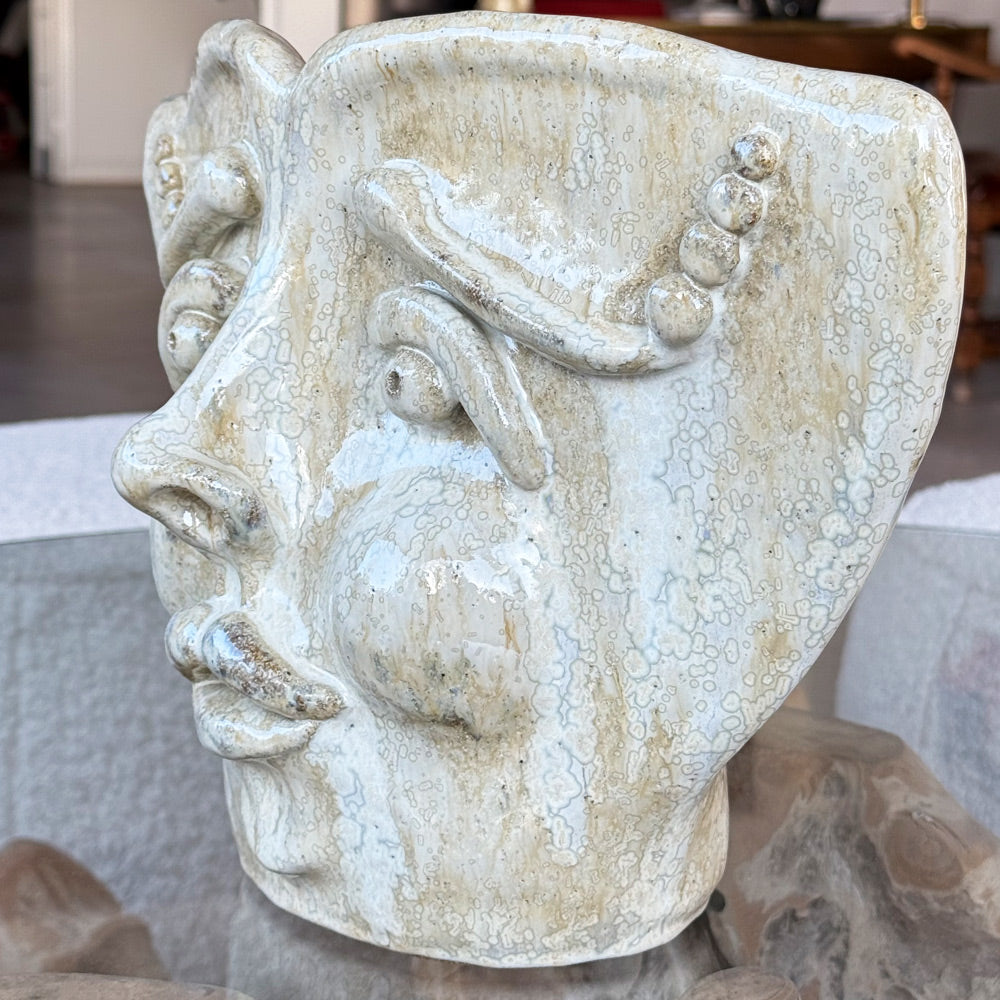 Unique beige face turnable table sculpture for home decor