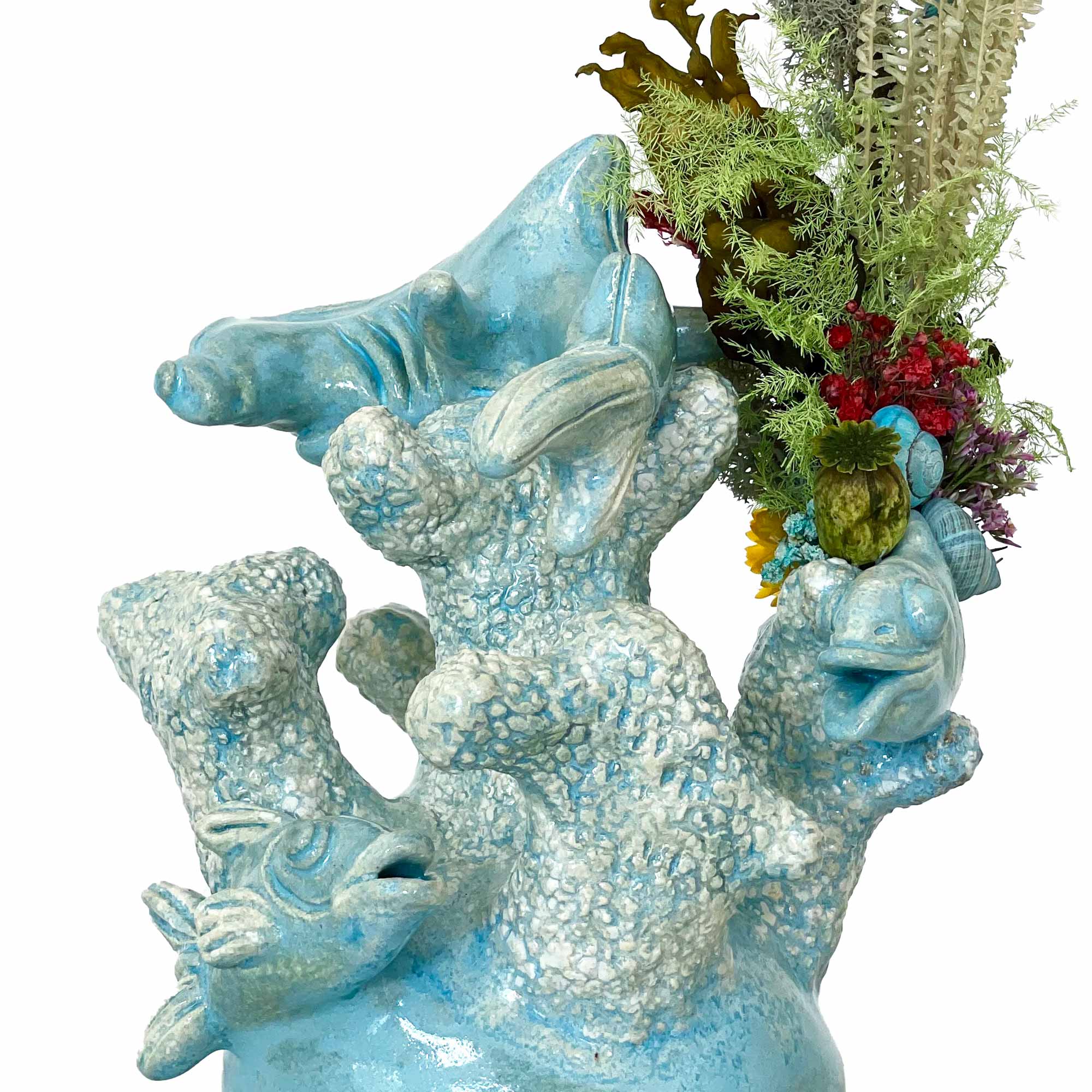 Tyrkis fiskeskulptur på restaurant Lumskbugten